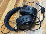 a pair of headphones sitting on top of a wooden floor