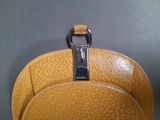 a close up of a purse with a metal handle