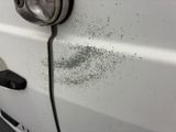 a close up of a car door with a lot of dirt on it