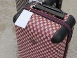 two pieces of luggage that are sitting on the ground
