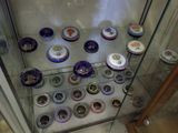 a glass display case filled with different types of cupcakes