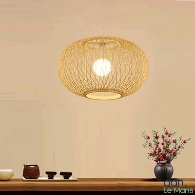 a table with a vase of flowers and a lamp on it