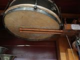 a large drum hanging from the ceiling in a room