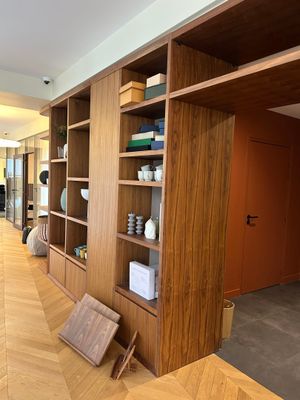 a room with a lot of bookshelves and shelves in it