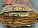 a close up of a piece of wood with a sticker on it