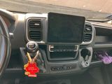 a car dashboard with a cell phone in the center of it