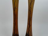 two vases that are sitting next to each other on a table