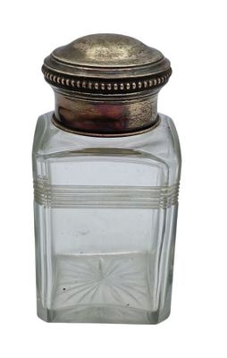 an image of a glass jar with a metal lid on a white background