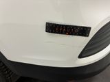 a sticker on the back of a white car