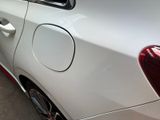 a white car with a red stripe on the side of it