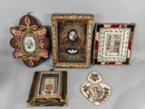 three framed pictures and a picture of a woman in a hat