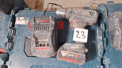 two tools that are sitting on top of a blue box