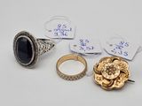 three rings and a ring with a flower on it