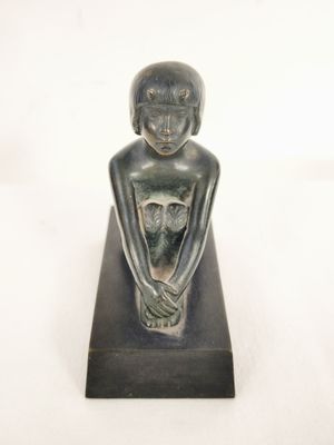 an image of a statue of a woman with a cat on her lap