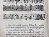an old book with a page of music written on it