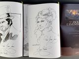 two books that are open to show a drawing of a man and a woman