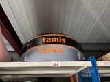 a tennis rack with a tennis ball on top of it