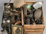 a wooden box filled with assorted items on a white surface