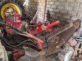 a tractor that is parked in a garage