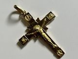 a close up of a cross on a table with a white background