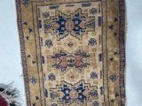 two rugs that are sitting on the floor