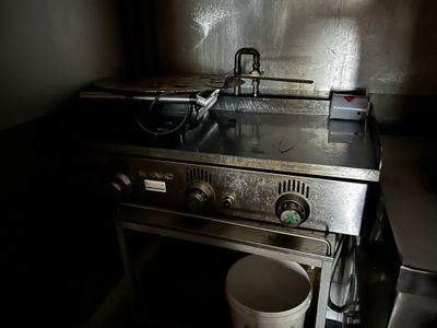 a pot sitting on the stove in the kitchen