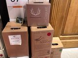several boxes stacked on top of each other in front of a door