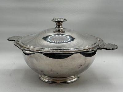 a silver plated bowl with a lid and a handle