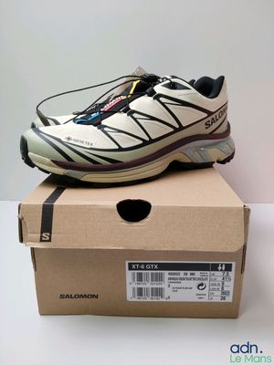 the shoe is sitting on top of a box on a table