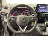 the interior of a car with a steering wheel and dashboard controls