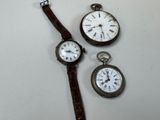 three different types of watches are displayed on a white surface