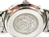 an image of a close up of a watch on a white surface
