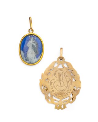 two gold pendants with a picture of a woman and a man