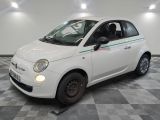 a picture of a small white car parked in a garage