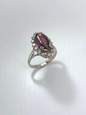 a close up of a ring on a white surface