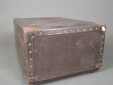 an old suitcase sitting on a table with a gray background
