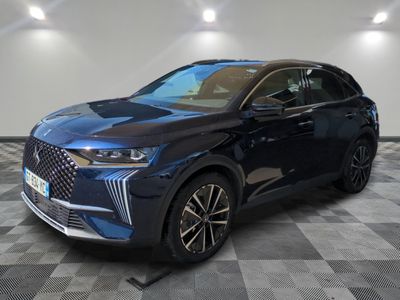 a blue suv parked in a room with a checkered floor