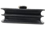 a black purse with a gold clasp on it