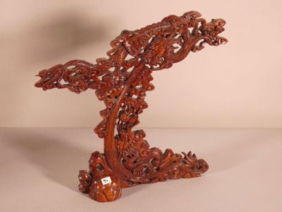 chinese carved wood table top with a bird on top of it