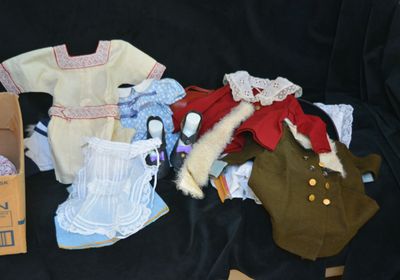 a box of clothes and other items on a black surface