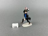 a miniature figurine of a man with a briefcase