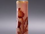 vase with a design of thistles and leaves on a pink background