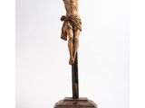 a statue of jesus on the cross on a pedestal