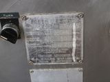 a close up of a metal door with a sign on it