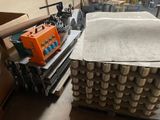 a stack of boxes and a machine in a warehouse