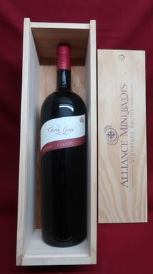 a bottle of wine in a wooden box on a red cloth