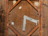 a picture of a wooden frame with a picture on it