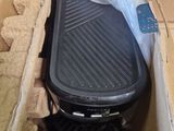a box that has a grill inside of it