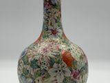 a vase that is sitting on a white surface