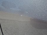 a close up of a car ' s door handle and the door handle of the car
